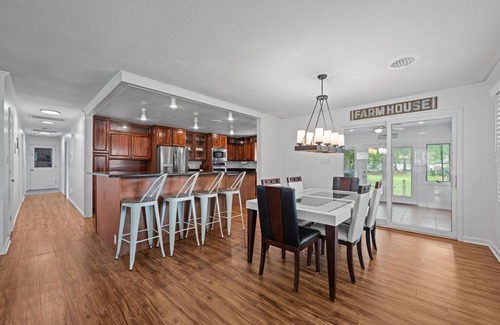 River Bend Casa | Quiet Riverfront 3BR/2BA house with Spa, Dock, and Golf Carts