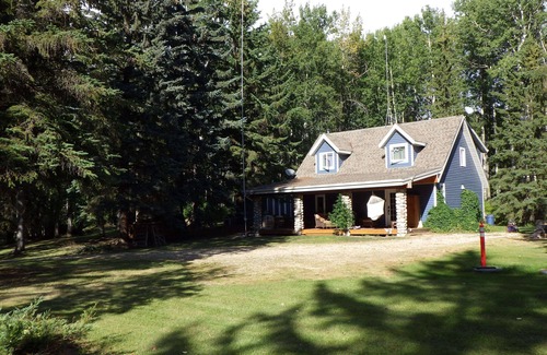 Parkland County Casa | Quiet , secluded , 5 acres outdoor fireplace , indoor wood stove , hot tub