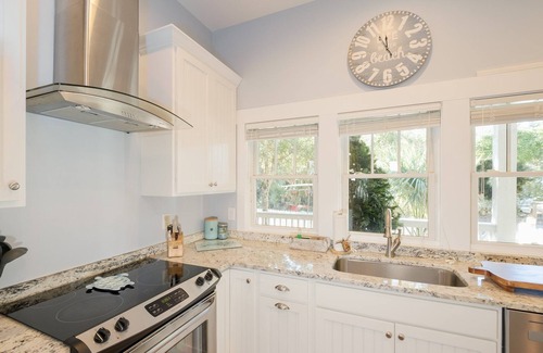 Cape Fear Station Casa | Reel Life tucked into a pretty, wooded bend in prestigious Cape Fear Station!