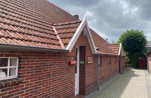 Strackholt Apartamento | Reihenhaus in Strackholt mit beheiztem Pool