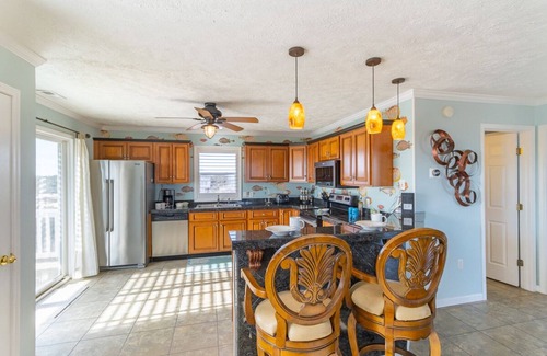 Corolla Casa | Relax among the dunes and see wild horses from the porch at Shifting Sands!