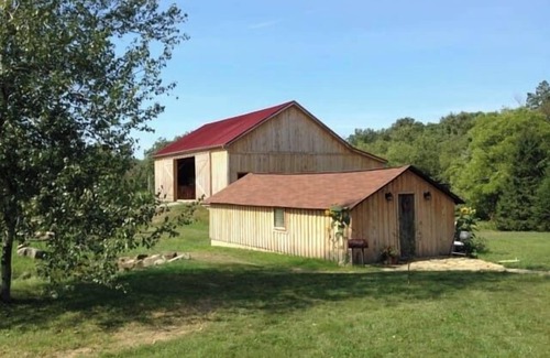 Champion Cabina | Hospédese en la cabaña bellamente restaurada en esta histórica granja orgánica de 52 acres