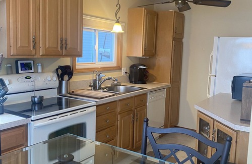 Lake Casa | Relax at the outdoor firepit or hot tub overlooking all-sports Eight Point Lake!