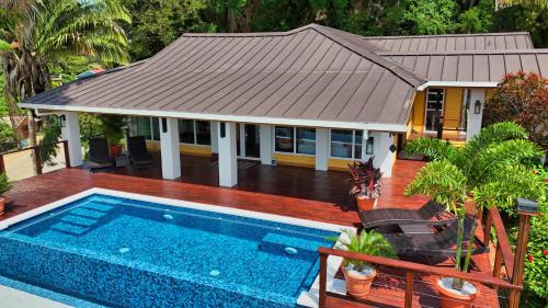 Gibson Bight Casa | Relax At This Hillside Retreat That Overlooks The Lush Forest And The Caribbean,