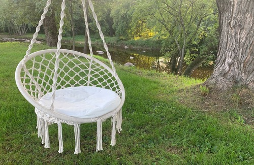 Babcock Casa | Relax by the river in this 4 bedroom house with firepit- spot our river eagle!