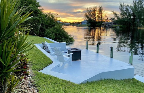 Burnt Store Casa | Relax!! Canal Home, Sunsets, Heated Pool, Lanai with TV, Boat Dock, Gulf Access