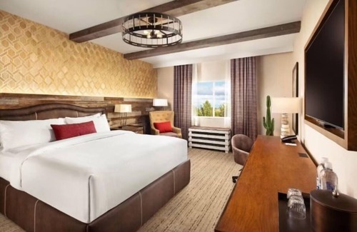 Enterprise Hotel | Relax in Comfort with a King Bed and Stunning Poolside Views
