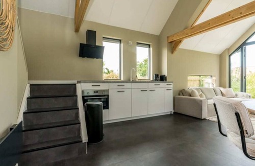 Westenschouwen Casa | Relax in this chalet, experience the spaciousness from the sofa, from the ridge beam to the surround