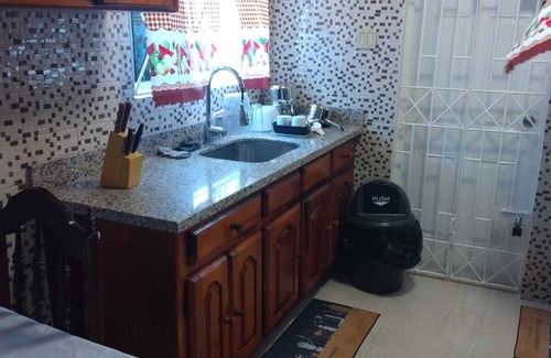 Spanish Town Zone Casa | Relax & Recharge in Spanish Town – 2BR Oasis w/ Hot Tub, AC & Wi-Fi