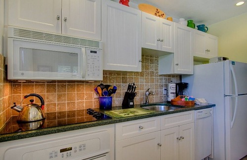 Sanibel Condominio | Relájese con los sonidos de las olas desde su propio bungalow en la playa.