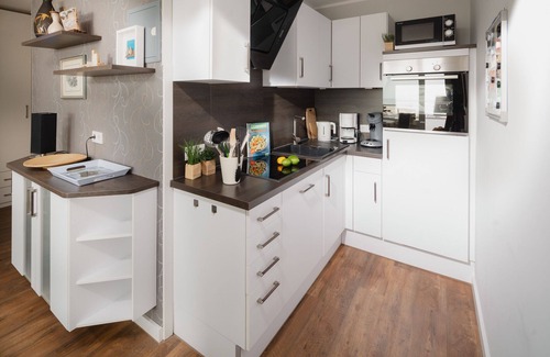 Norderney Apartamento | "Relax with a sea view: Above the rooftops of Norderney"