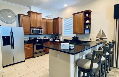 Bahama Beach Condominio | Remodeled 3 BR/2BA condo steps to the beach! Sunset views and private garage.