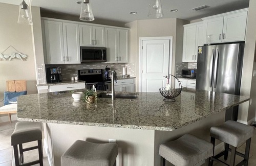 Pelican Preserve Condominio | Resort Style 55+ Community! Includes golf cart and amazing sunset views!