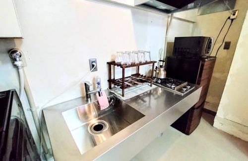 Yokosuka Casa | Retro Romantic Room! Private rooftop room with a view of Tokyo Bay beyond the Uraga Dock.
