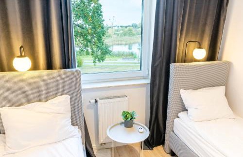 Ilawa Apartamento | River View - widok na wodę, parking w hali, winda, 3pok i 5 łóżek, klima, Netflix i Max, centrum
