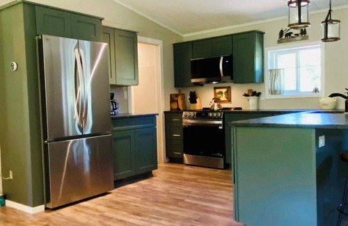 Trail Casa | Riverfront Gem with Big Deck, Fishing & Adventure. Comfy beds, upgraded beauty