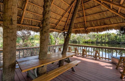 Braden River Casa | Riverside Oasis Home w Tiki Hut & Firepit