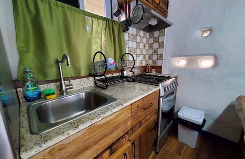 Runaway Bay Cabaña | Rustic Cottage - A/C, Parking, Pool & Beach Access