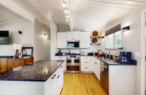 Central Colorado Springs Casa | Rustic mountain view home w/ large yard, pond, & updated kitchen - dog-friendly