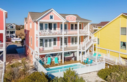 Holden Beach Casa | "Salty Pink Flamingo" is a stunning 6-bedroom, 4-bathroom oceanfront retreat with a private pool, hot tub, and elevator.