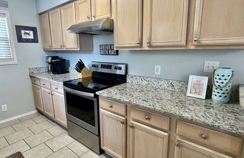 Surfside Beach Casa | 'Pies Retiro de Sandy ... Pasos de la playa, Se aceptan mascotas, Familia Beach Cottage