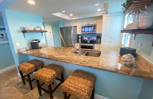 Punta Rassa Condominio | Vistas al agua, balcón privado alrededor del séptimo piso en Sanibel Harbour Resort
