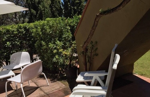 Santa Margherita di Pula Casa | Santa Margherita di Pula: casa adosada con jardín a 200 metros del mar