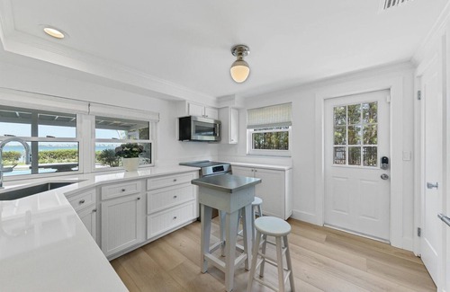 Cherokee Park Casa | Sarasota Renovated Waterfront Home with Dock Wide Open Bay Views Heated Pool