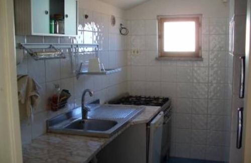Santa Teresa di Gallura Apartamento | Seaview cozy penthouse 300m walk to the beach, large terrace. Center Village.