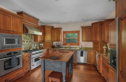 Huntly Casa | Secluded 4 bedroom log style home with screened porches, deck and fishing pond.