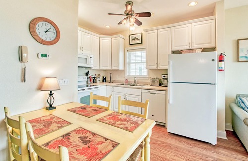Hatteras Condominio | Second-floor oceanfront home with outdoor pool, hot tub, pool table, & W/D