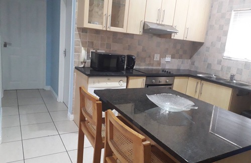 Bloubergstrand Apartamento | Apartamento de 2 dormitorios con cocina