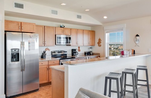 Kill Devil Hills Condominio | Siete Cs 402: Mejor nivel condominio, frente al mar, piscina comunitaria, comunidad de camino privado a la playa.