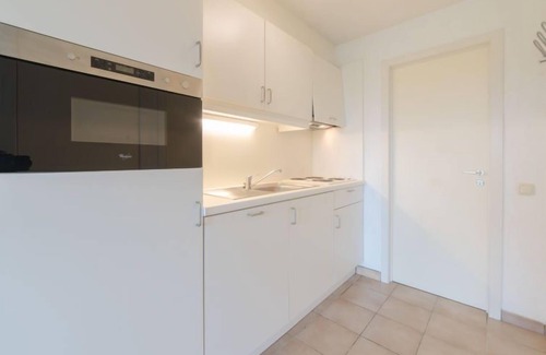 De Haan Apartamento | Siena with parking and shared pool by Interhome