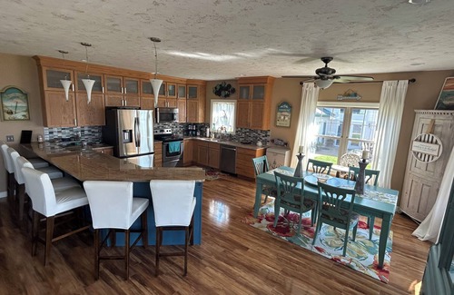 Prudenville Casa | Spacious 4-bedroom lakefront house on Houghton Lake with beach and tiki bar