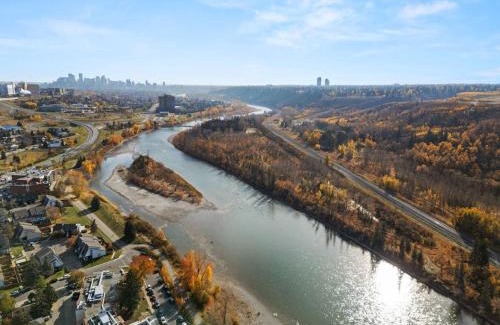 Montgomery Casa | Spacious 4-Bedroom Retreat Near Bow River with Foosball, Dart Board, Movie Room