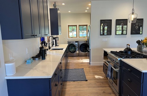 Suttons Bay Otro | Spacious 5-bedroom farmhouse in lovely Omena, MI with AC, WiFi & lake views