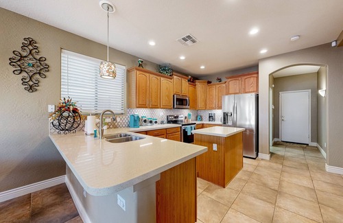 Glendale Casa | Spacious home surrounded by palms with pool, grill, children's items, & W/D