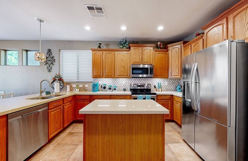 Glendale Casa | Spacious home surrounded by palms with pool, grill, children's items, & W/D
