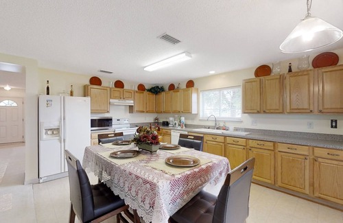 Westside Casa | Spacious home with sunroom, patio, fireplace, & water views