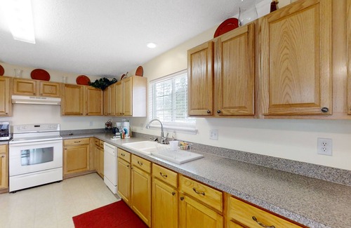 Westside Casa | Spacious home with sunroom, patio, fireplace, & water views
