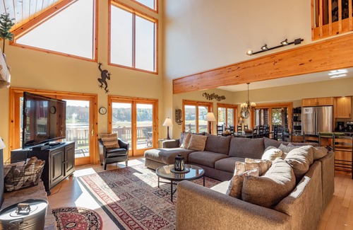 Waterfront Greens Casa | Spacious Lake Escape w/ Hot Tub, Dock & Fireplace