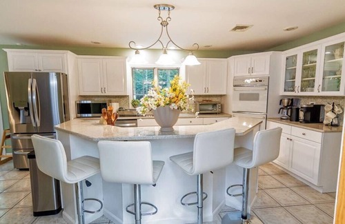 Stroudsburg Casa | Spacious luxury home with a large private backyard, seasonal in-ground pool, and year-round sauna an