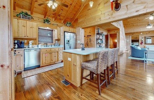 Big Creek Cabina | Spacious waterfront property with deck, hot tub, kayak, fireplace, & central AC