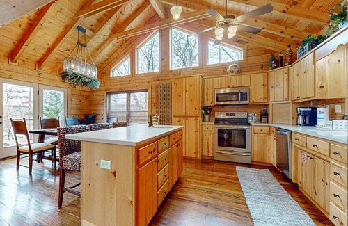 Big Creek Cabina | Spacious waterfront property with deck, hot tub, kayak, fireplace, & central AC