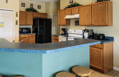 Crescent Lakes Villa | Sprawling Private Pool Home near Disney w/ Pond Views & Game Room