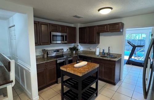 St. Petersburg - Clearwater Casa | 20% Off NEW 4BR Poolside Tampa Gem w/ Private Gym!