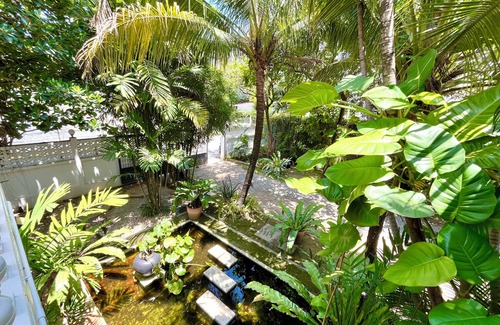 Chang Phueak Casa | Stay in Style: Cozy AC Room, Tropical Garden & Prime Location.