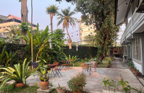 Chang Phueak Casa | Stay in Style: Cozy AC Room, Tropical Garden & Prime Location.