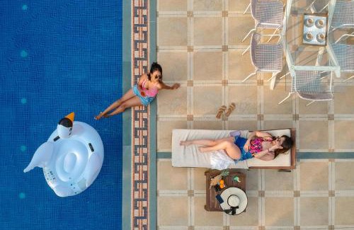 Kune Village Villa | StayVista's Le Sutra Great Escapes - 5BR - Geometrica - Artistic Rooms, Mountain View, Pool, and Gazebo Retreat